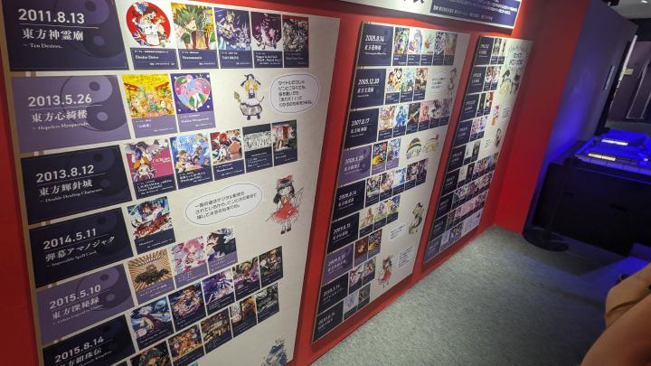 Works depicting various Touhou music albums hanging on the wall