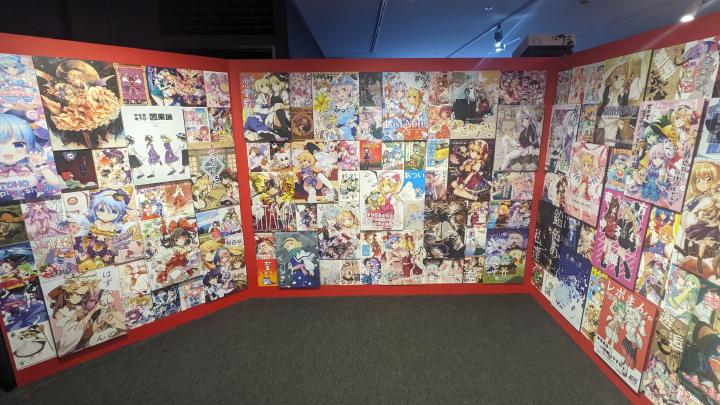 Wall of various arts and posters related to Touhou Project